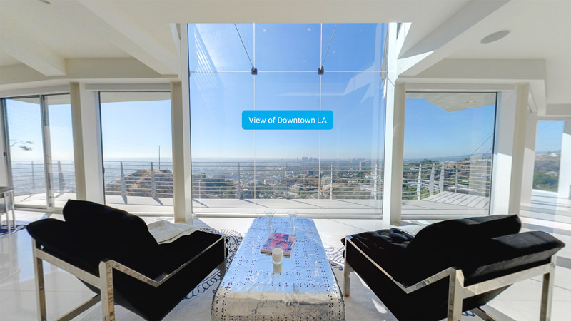 A screenshot from the app showing a home with downtown LA visible in the window